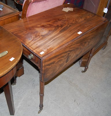 Lot 658 - A Regency mahogany and ebony lined drop-leaf...