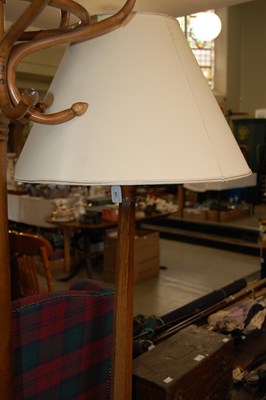 Lot 661 - An Art Deco style oak octagonal standard lamp...