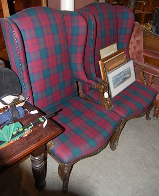Lot 662 - A pair of tartan upholstered wing back...