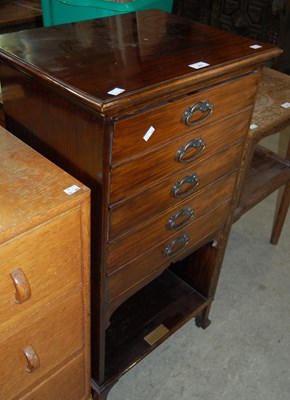 Lot 671 - An Edwardian mahogany music cabinet fitted...