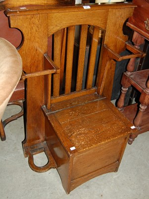 Lot 697 - An early 20th century oak combination hall...