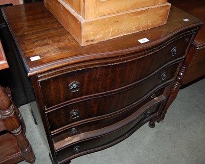 Lot 700 - A reproduction mahogany four drawer serpentine...