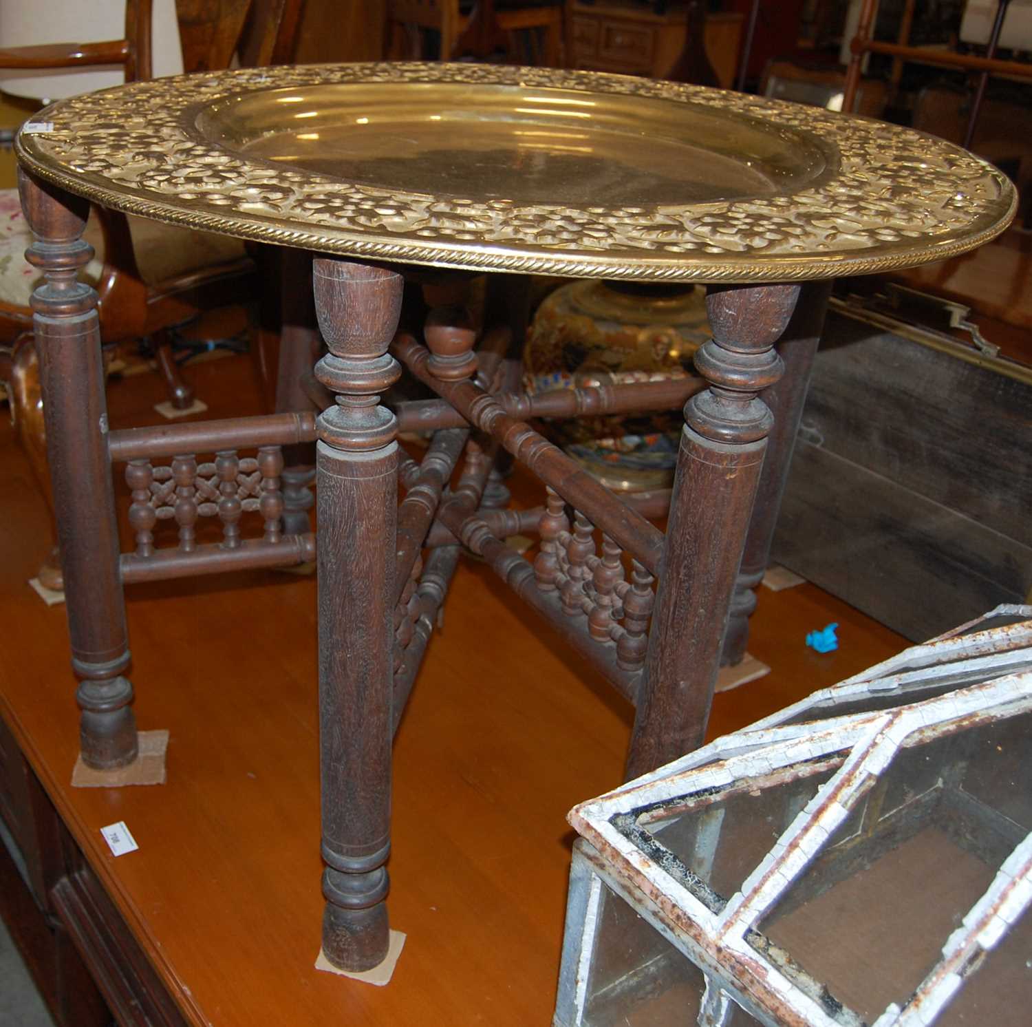 Lot 706 - An Indian brass topped occasional table on...