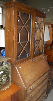 Lot 714 - A reproduction mahogany bureau bookcase