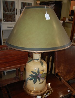 Lot 722 - A decorative tea tin type table lamp and shade...