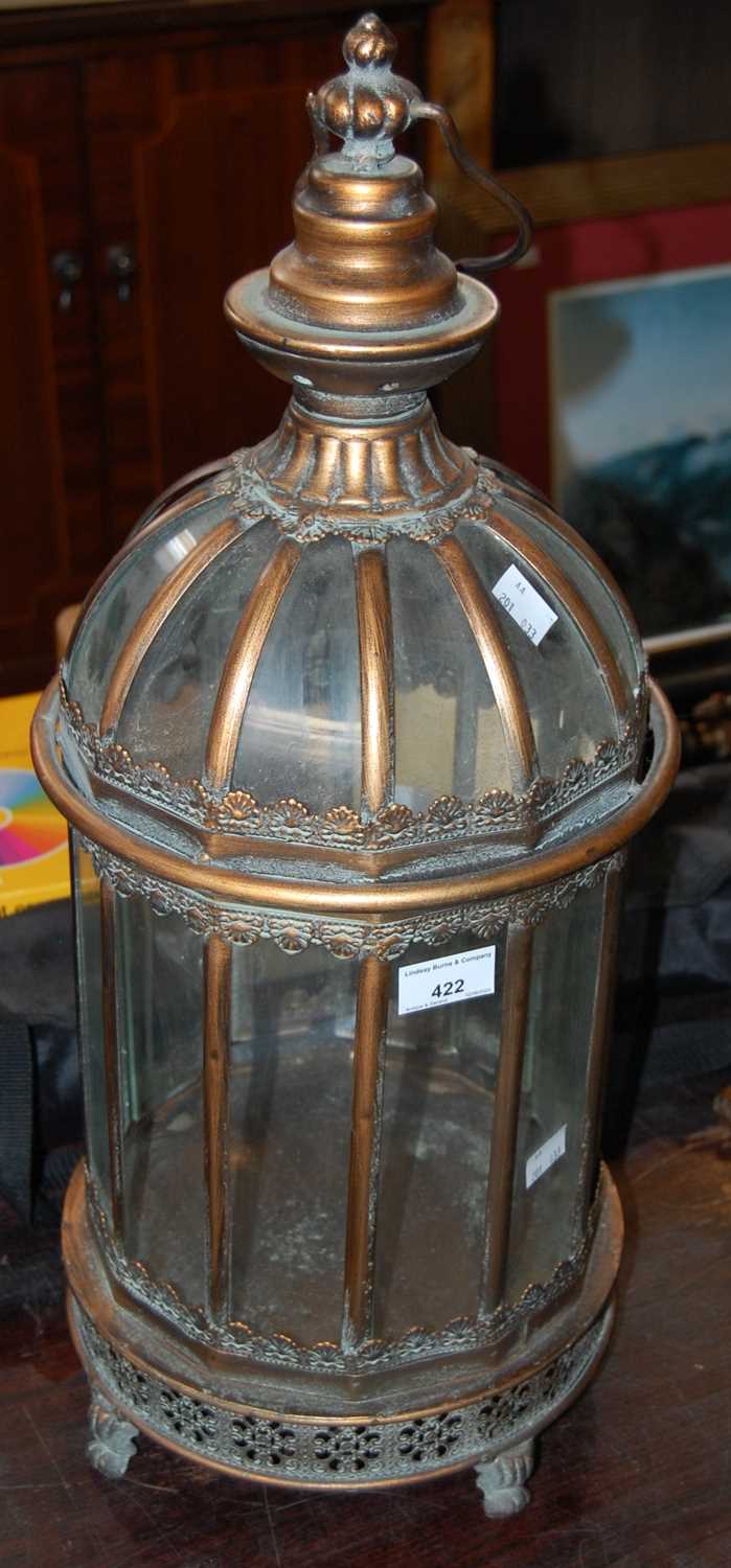 Lot 422 - A decorative gilt metal and clear glass dome...