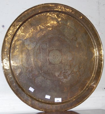 Lot 694 - A Persian brass circular tray / table top,...