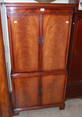 Lot 695 - A reproduction mahogany four door side cabinet