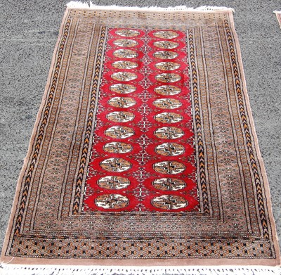 Lot 815 - A Tekke type rug, the madder field centred...