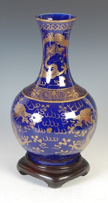 Lot 689 - A Chinese porcelain powder-blue ground bottle vase, Qing Dynasty