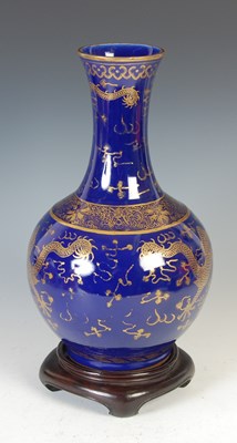 Lot 689 - A Chinese porcelain powder-blue ground bottle vase, Qing Dynasty