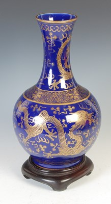 Lot 689 - A Chinese porcelain powder-blue ground bottle vase, Qing Dynasty