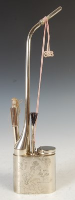 Lot 693 - A Chinese white metal opium pipe, late 19th/ early 20th century
