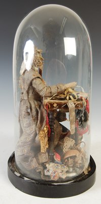 Lot 159 - A late 19th century 'Pedlar' doll mounted in a glass dome