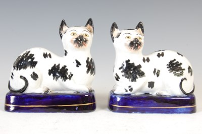 Lot 620 - A rare pair of 19th century Staffordshire pottery cats