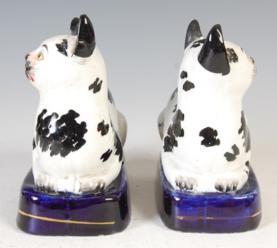 Lot 620 - A rare pair of 19th century Staffordshire pottery cats