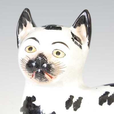 Lot 620 - A rare pair of 19th century Staffordshire pottery cats