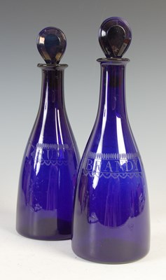 Lot 536 - A pair of late 18th/ early 19th century Bristol blue glass decanters and stoppers