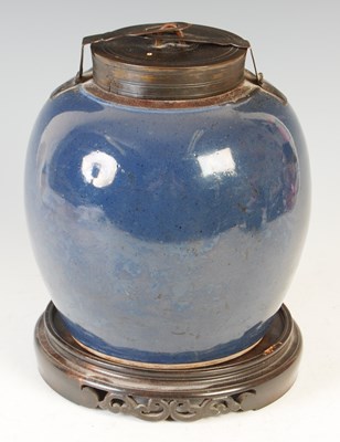 Lot 663 - A Chinese porcelain powder blue ground jar and bronze cover, Qing Dynasty