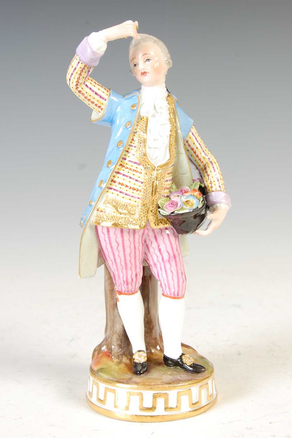 Lot 628 - A 19th century Meissen figure of an 18th century gentleman