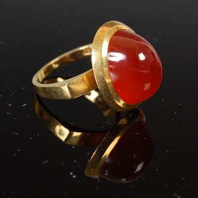 Lot 508 - Bucherer, a yellow metal carnelian cabochon ring