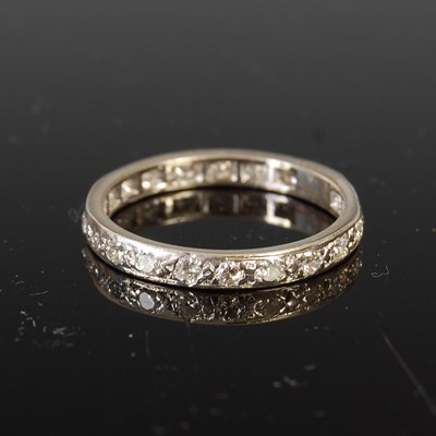 Lot 498 - A mid 20th century white metal and diamond eternity ring