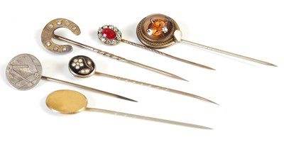 Lot 489 - A group of six late 19th/ early 20th century stick pins