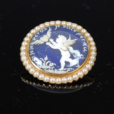 Lot 503 - An early to mid 20th century French yellow metal split pearl and blue enamel reverse