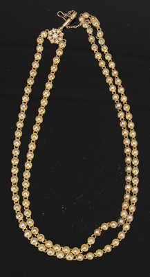 Lot 531 - A late 19th century yellow metal and split pearl necklace