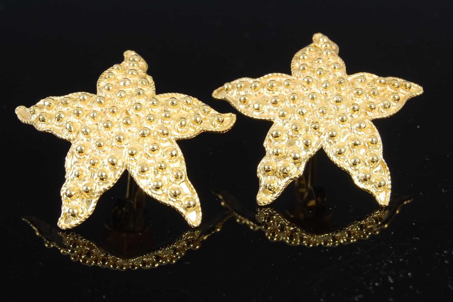 Lot 472 - A pair of 20th century Yemeni high carat yellow metal starfish shaped earrings