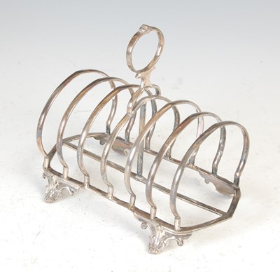 Lot 412 - A Victorian silver seven bar toast rack, London, 1856, makers mark of CTF. over GF.