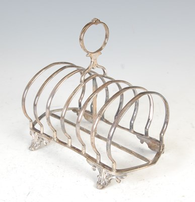 Lot 412 - A Victorian silver seven bar toast rack, London, 1856, makers mark of CTF. over GF.