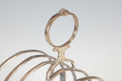 Lot 412 - A Victorian silver seven bar toast rack, London, 1856, makers mark of CTF. over GF.