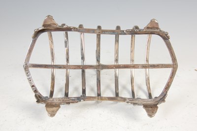 Lot 412 - A Victorian silver seven bar toast rack, London, 1856, makers mark of CTF. over GF.