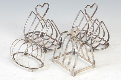 Lot 406 - A collection of early 20th century electroplated and silver toast racks