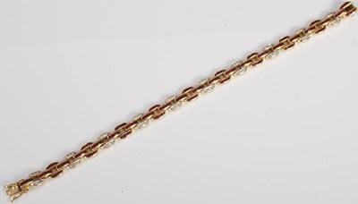 Lot 527 - A 20th century Art Deco style yellow metal, ruby and diamond set bracelet