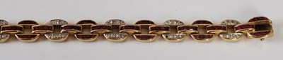 Lot 527 - A 20th century Art Deco style yellow metal, ruby and diamond set bracelet