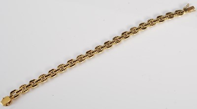 Lot 527 - A 20th century Art Deco style yellow metal, ruby and diamond set bracelet