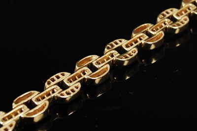 Lot 527 - A 20th century Art Deco style yellow metal, ruby and diamond set bracelet