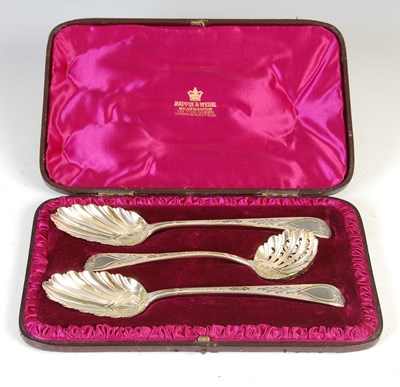 Lot 405 - A 19th century silver gilt three-piece spoon set