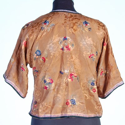 Lot 708 - A Chinese purple ground embroidered ladies silk jacket and matching pantalons
