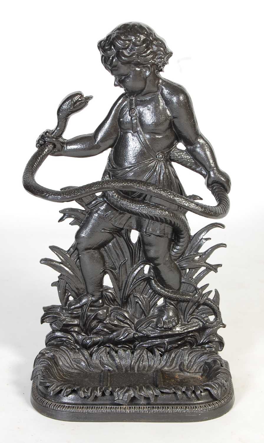 Lot 819 - A cast iron cherub and serpent stick stand,...