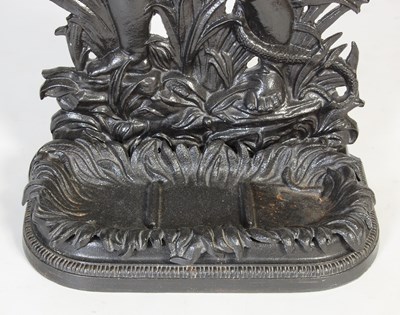 Lot 819 - A cast iron cherub and serpent stick stand,...