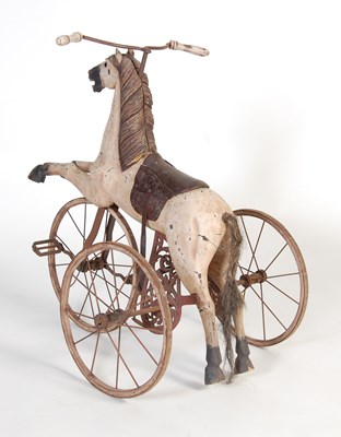 Lot 15 - A Victorian style merry-go-round carved wooden horse converted to a tricycle