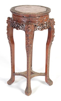 Lot 83 - A Chinese dark wood urn stand, Qing Dynasty