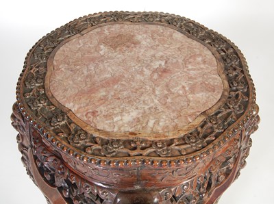 Lot 83 - A Chinese dark wood urn stand, Qing Dynasty