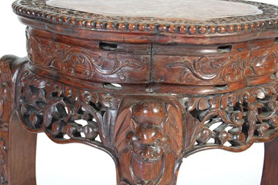 Lot 83 - A Chinese dark wood urn stand, Qing Dynasty