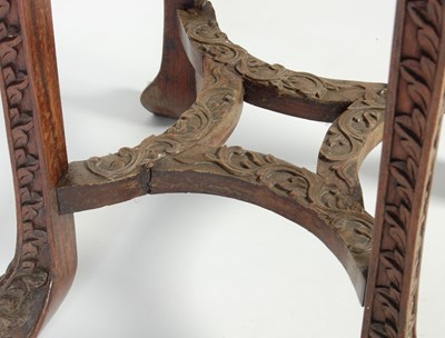 Lot 83 - A Chinese dark wood urn stand, Qing Dynasty