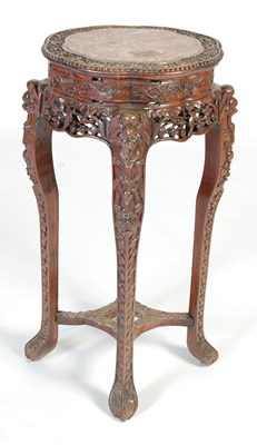 Lot 83 - A Chinese dark wood urn stand, Qing Dynasty