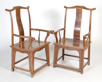 Lot 90 - A pair of Chinese Jichimu (chicken-wing wood) 'Officials Hat' elbow chairs